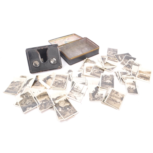 218 - An early 20th Century circa 1920s / 1930s metal folding camerascope viewer to include cards depictin... 