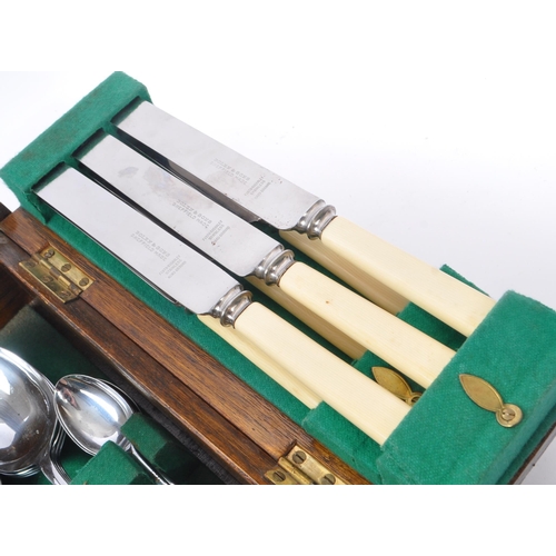 219 - Bolen & Sons - A 20th Century canteen of cutlery for six people having faux ivorine plastic handles.... 
