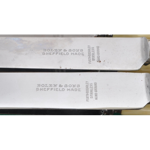 219 - Bolen & Sons - A 20th Century canteen of cutlery for six people having faux ivorine plastic handles.... 