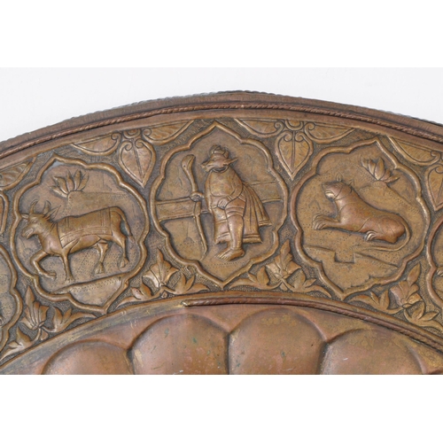 224 - An early 20th century Indian large copper wall plate charger. Featuring a horse and cart motif to ce... 
