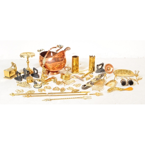 227 - A collection of 19th century and later copper and brass wares. To include flat irons and skillets, c... 