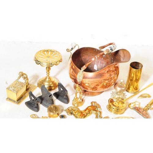 227 - A collection of 19th century and later copper and brass wares. To include flat irons and skillets, c... 