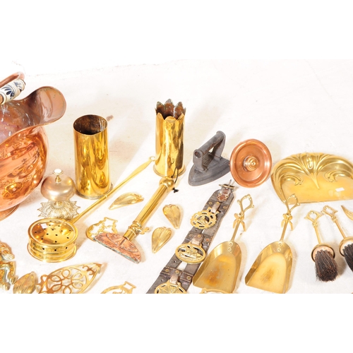 227 - A collection of 19th century and later copper and brass wares. To include flat irons and skillets, c... 