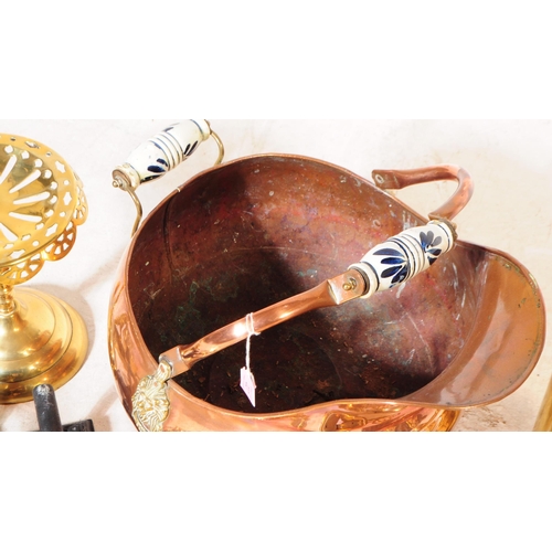 227 - A collection of 19th century and later copper and brass wares. To include flat irons and skillets, c... 