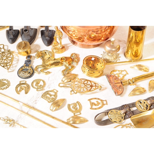 227 - A collection of 19th century and later copper and brass wares. To include flat irons and skillets, c... 