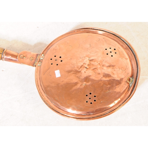 227 - A collection of 19th century and later copper and brass wares. To include flat irons and skillets, c... 