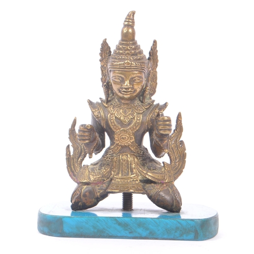 228 - A Burmese bronze Buddha figure on a blue rectangular resin base with hands in fists raised to front,... 
