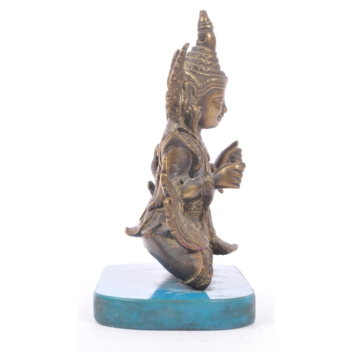 228 - A Burmese bronze Buddha figure on a blue rectangular resin base with hands in fists raised to front,... 