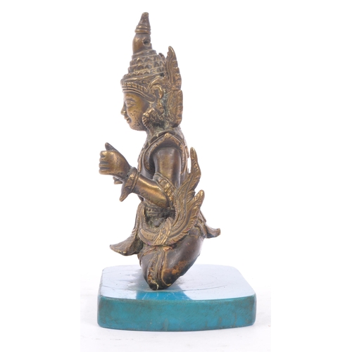 228 - A Burmese bronze Buddha figure on a blue rectangular resin base with hands in fists raised to front,... 