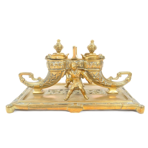 229 - A 19th Century large Chinese brass inkwell with liners, having rectangular base with two ink pots in... 