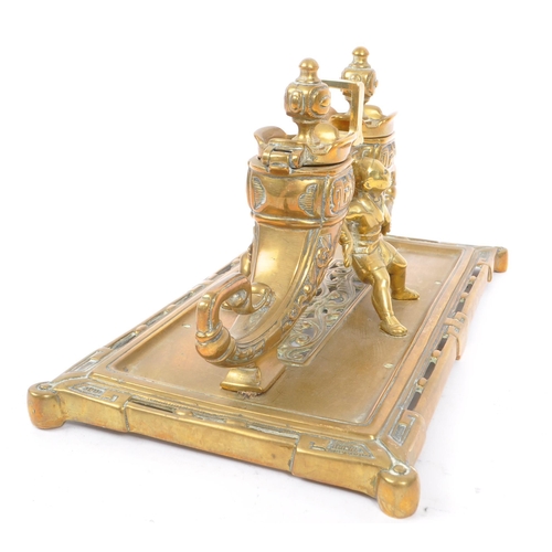 229 - A 19th Century large Chinese brass inkwell with liners, having rectangular base with two ink pots in... 