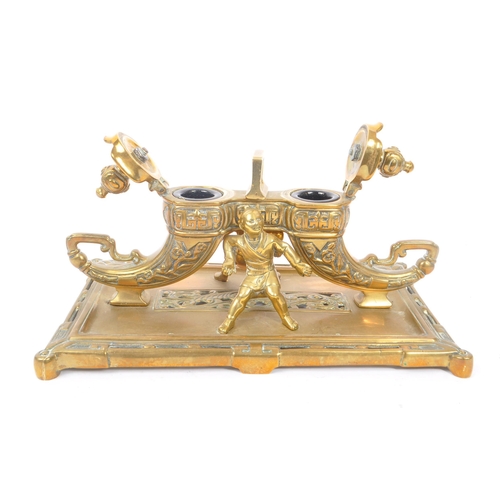 229 - A 19th Century large Chinese brass inkwell with liners, having rectangular base with two ink pots in... 