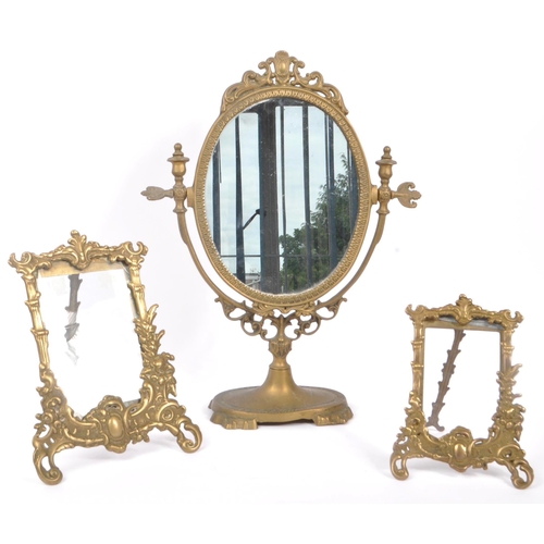 230 - Two early 20th Century rococo manner brass picture frames of varying size together with a brass oval... 