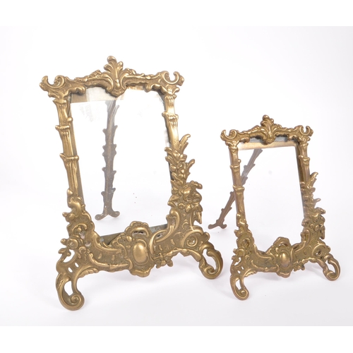 230 - Two early 20th Century rococo manner brass picture frames of varying size together with a brass oval... 
