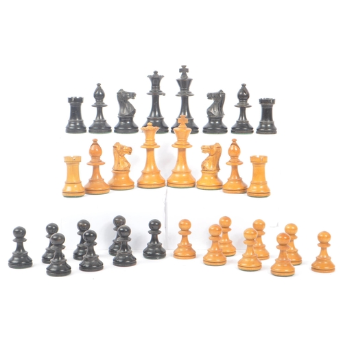 233 - A 20th Century set of staunton standard style of carved wooden chess pieces having felt to bottom. K... 