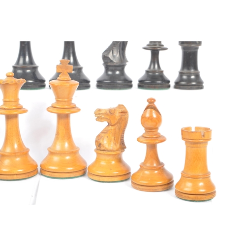 233 - A 20th Century set of staunton standard style of carved wooden chess pieces having felt to bottom. K... 