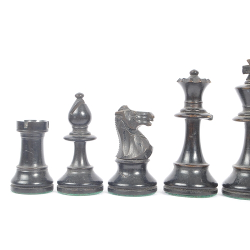 233 - A 20th Century set of staunton standard style of carved wooden chess pieces having felt to bottom. K... 