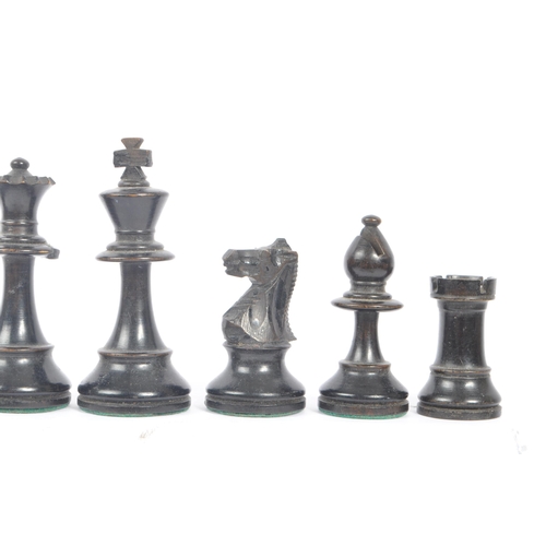 233 - A 20th Century set of staunton standard style of carved wooden chess pieces having felt to bottom. K... 