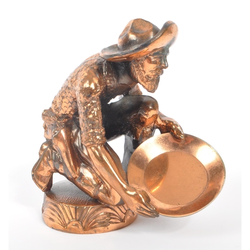 234 - A 20th Century vintage American copper effect figure in the form of a gold miner / panning man kneel... 