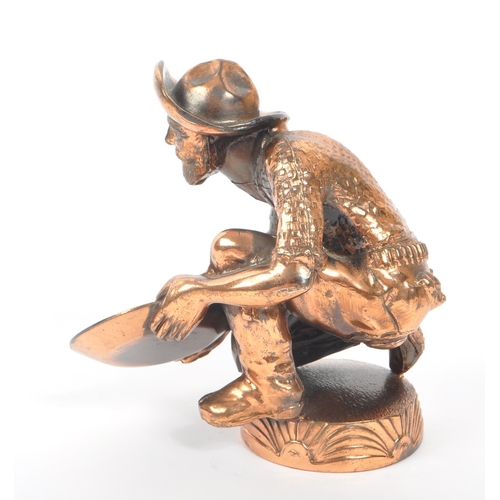 234 - A 20th Century vintage American copper effect figure in the form of a gold miner / panning man kneel... 