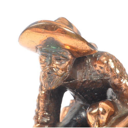 234 - A 20th Century vintage American copper effect figure in the form of a gold miner / panning man kneel... 