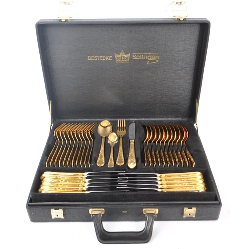 235 - A 20th Century German Bestecke SBS Solingen gold plated 12 person canteen of cutlery to include tabl... 