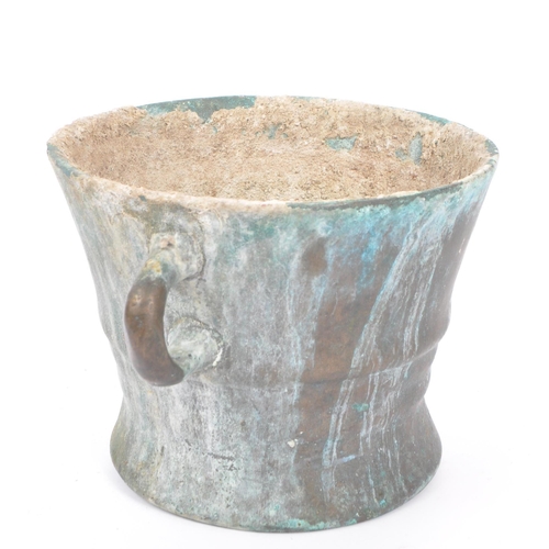 239 - A large late 17th Century bronze twin handled mortar bowl / pot having rounded handles to either sid... 