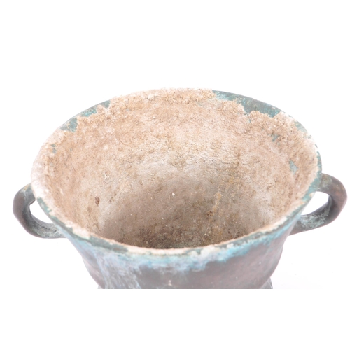 239 - A large late 17th Century bronze twin handled mortar bowl / pot having rounded handles to either sid... 