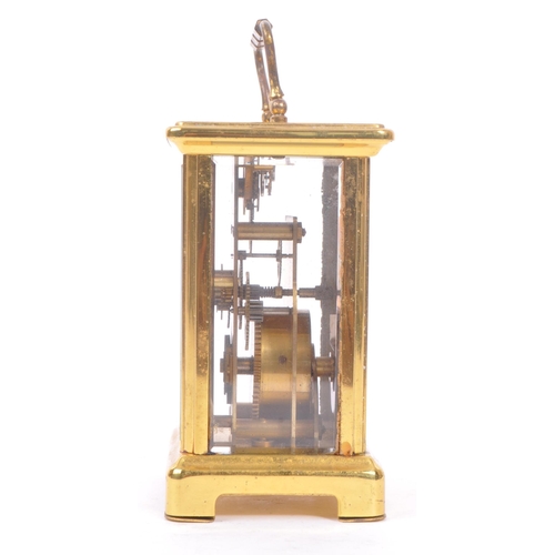 240 - Bayard, France - A 20th century brass eight day carriage clock. With carry handle to top, white face... 