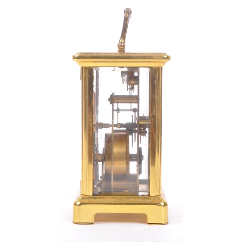 240 - Bayard, France - A 20th century brass eight day carriage clock. With carry handle to top, white face... 