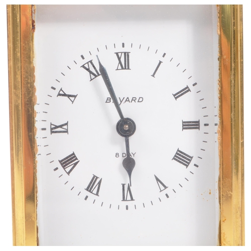 240 - Bayard, France - A 20th century brass eight day carriage clock. With carry handle to top, white face... 