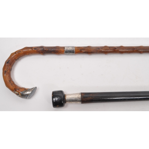 244 - Two early 20th century walking stick / canes. Circa 1910s with silver bands, one hallmarked other st... 