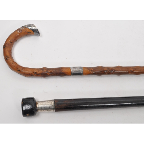 244 - Two early 20th century walking stick / canes. Circa 1910s with silver bands, one hallmarked other st... 