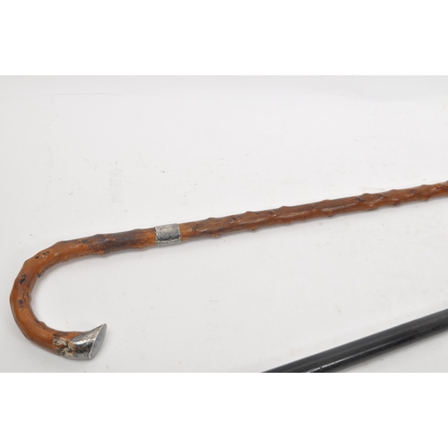 244 - Two early 20th century walking stick / canes. Circa 1910s with silver bands, one hallmarked other st... 