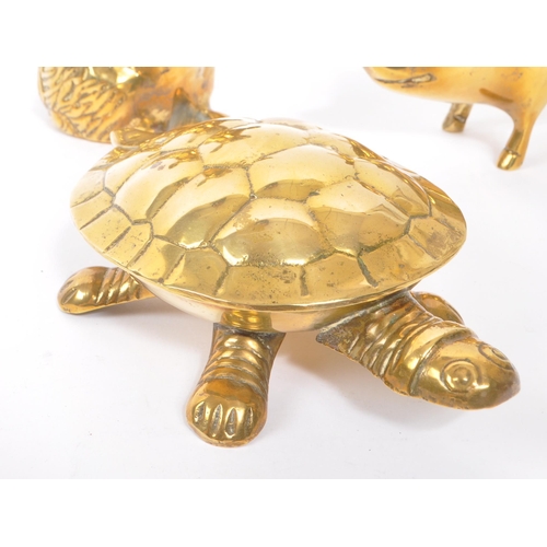 245 - A collection of 20th century brass animal figures. The collection to include a brass pig money box, ... 