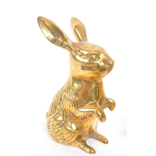 245 - A collection of 20th century brass animal figures. The collection to include a brass pig money box, ... 