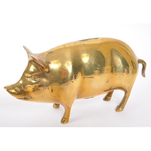 245 - A collection of 20th century brass animal figures. The collection to include a brass pig money box, ... 