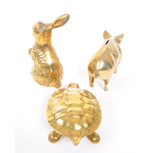 245 - A collection of 20th century brass animal figures. The collection to include a brass pig money box, ... 