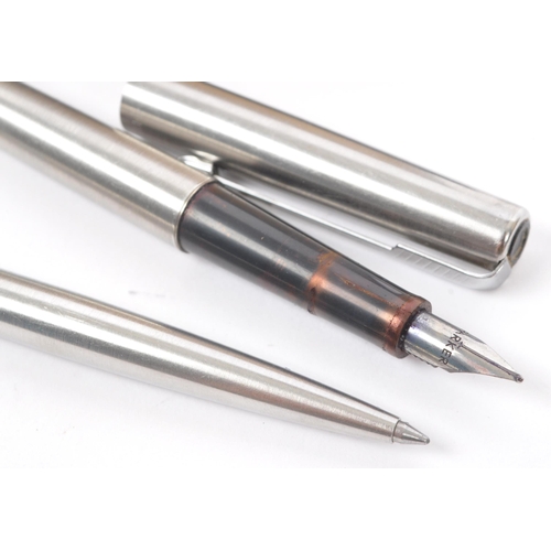 246 - Conway Stewart - A mid 20th century Conway Stewart 14ct nib fountain pen, alongside a Parker writing... 
