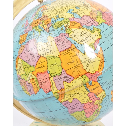 248 - A mid 20th century tin plate globe. The globe having a plastic mount with tin base and globe, featur... 