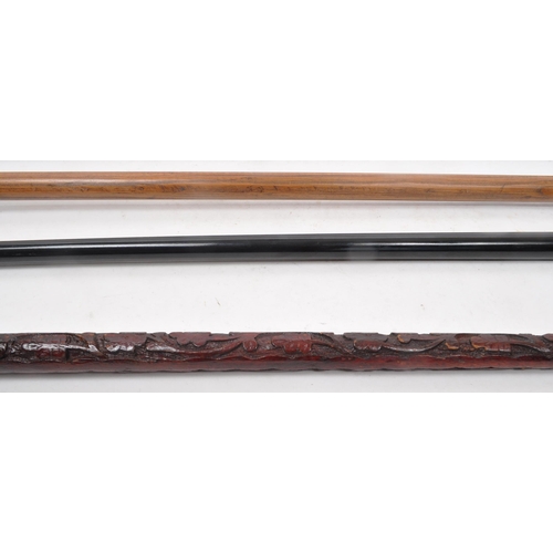 251 - A collection of five mid 20th century walking sticks. The collection to include an Italian Cavagnini... 