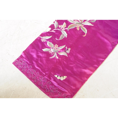 256 - Mid Century Chinese silk clothing items having intricate foliate embroidery of peonies and butterfli... 