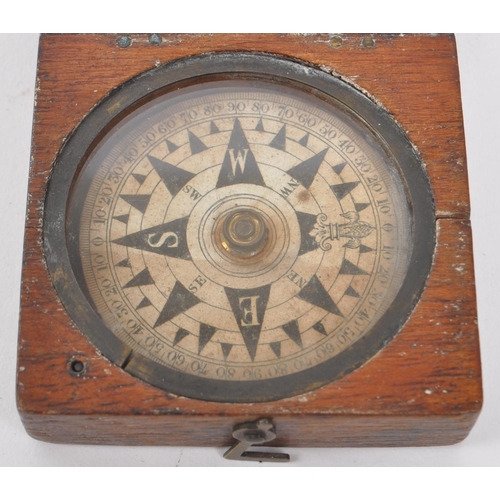 257 - A 19th century Victorian traveling compass. Mahogany case with hinged lid, and glass circular window... 