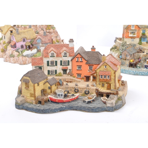 259 - Danbury Mint - A collection of eight Danbury Mint scenic models to include items from the The RNLI C... 