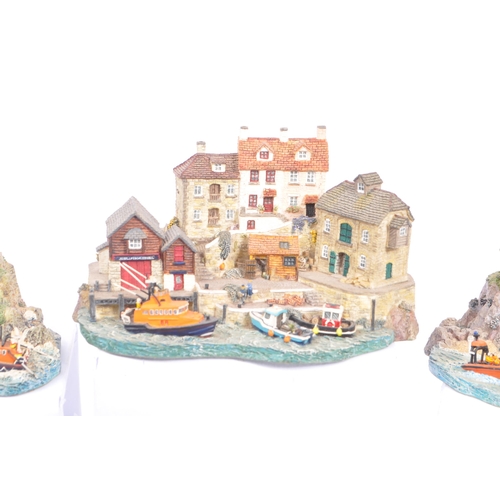 259 - Danbury Mint - A collection of eight Danbury Mint scenic models to include items from the The RNLI C... 