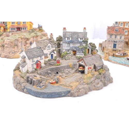 260 - Danbury Mint - A collection of eight Danbury Mint scenic models depicting harbourside / seascape sce... 