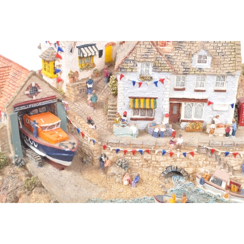 260 - Danbury Mint - A collection of eight Danbury Mint scenic models depicting harbourside / seascape sce... 