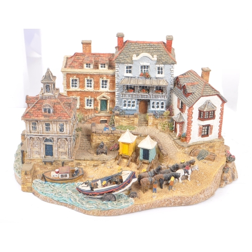 260 - Danbury Mint - A collection of eight Danbury Mint scenic models depicting harbourside / seascape sce... 