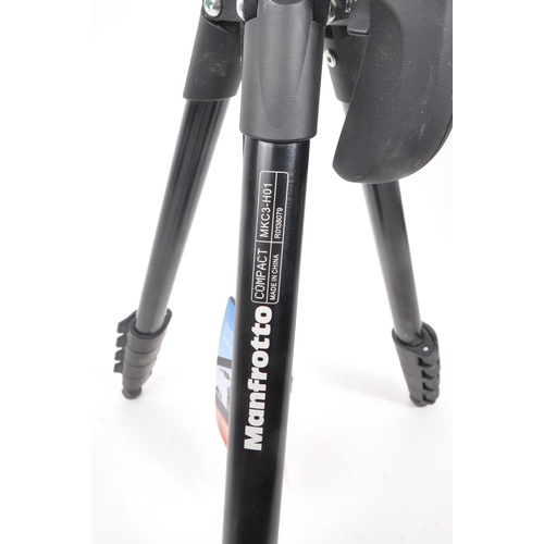 261 - A Manfrotto MKC3-H01 compact photo-movie kit tripod. Of aluminium and plastic construction with a pi... 