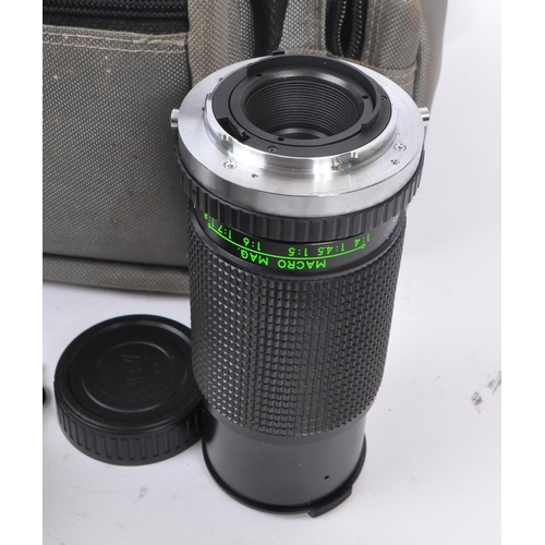 265 - Olympus - A late 20th century circa 1980s Olympus OM10 35mm SLR camera and accessories. The camera i... 